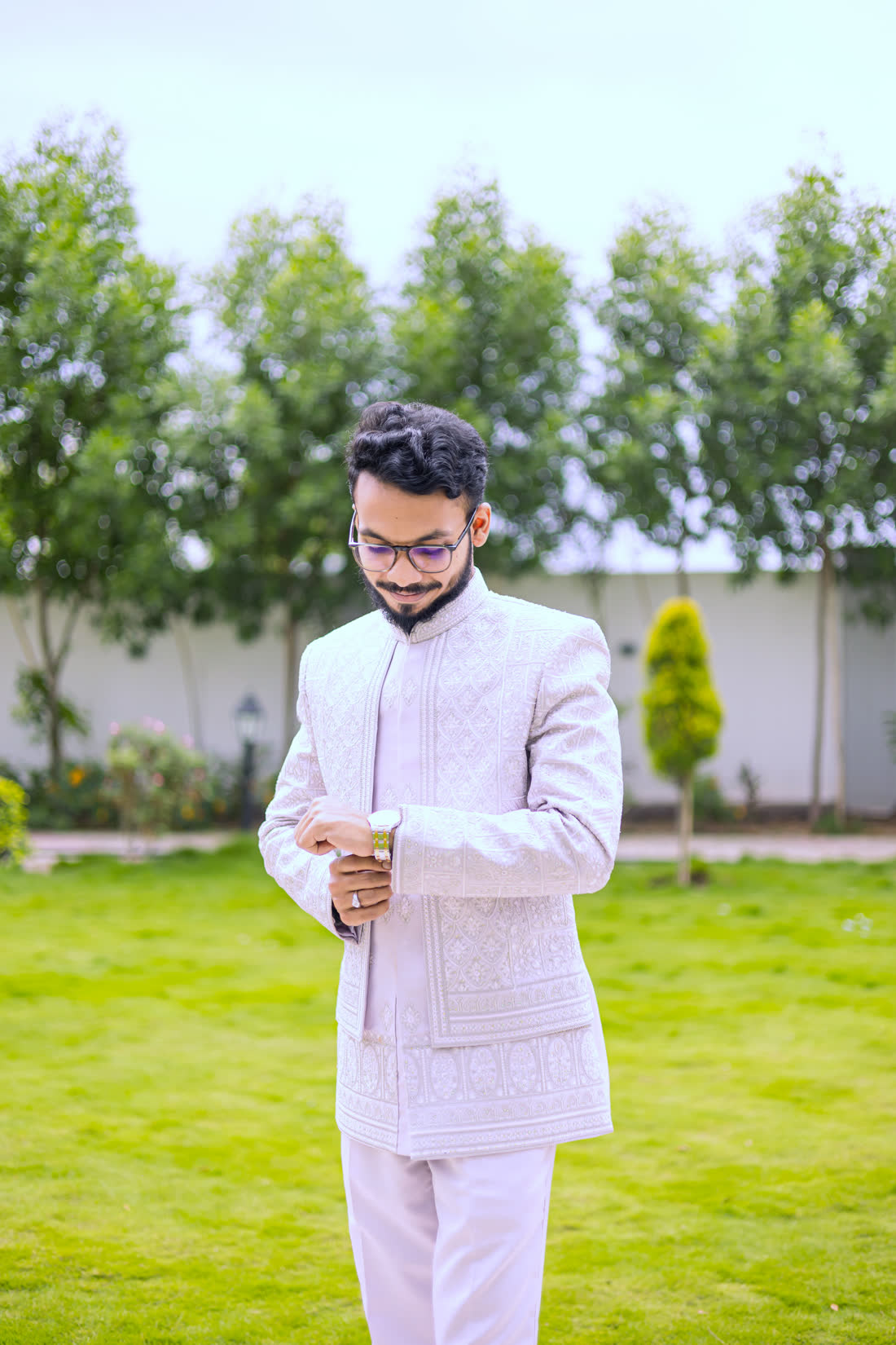 Tousif fastening his watch